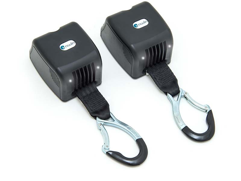 Electric retractors for front wheelchair tie-down