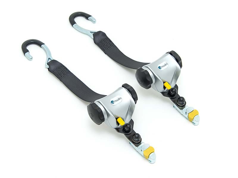 Mechanical retractors for wheelchair tie-down